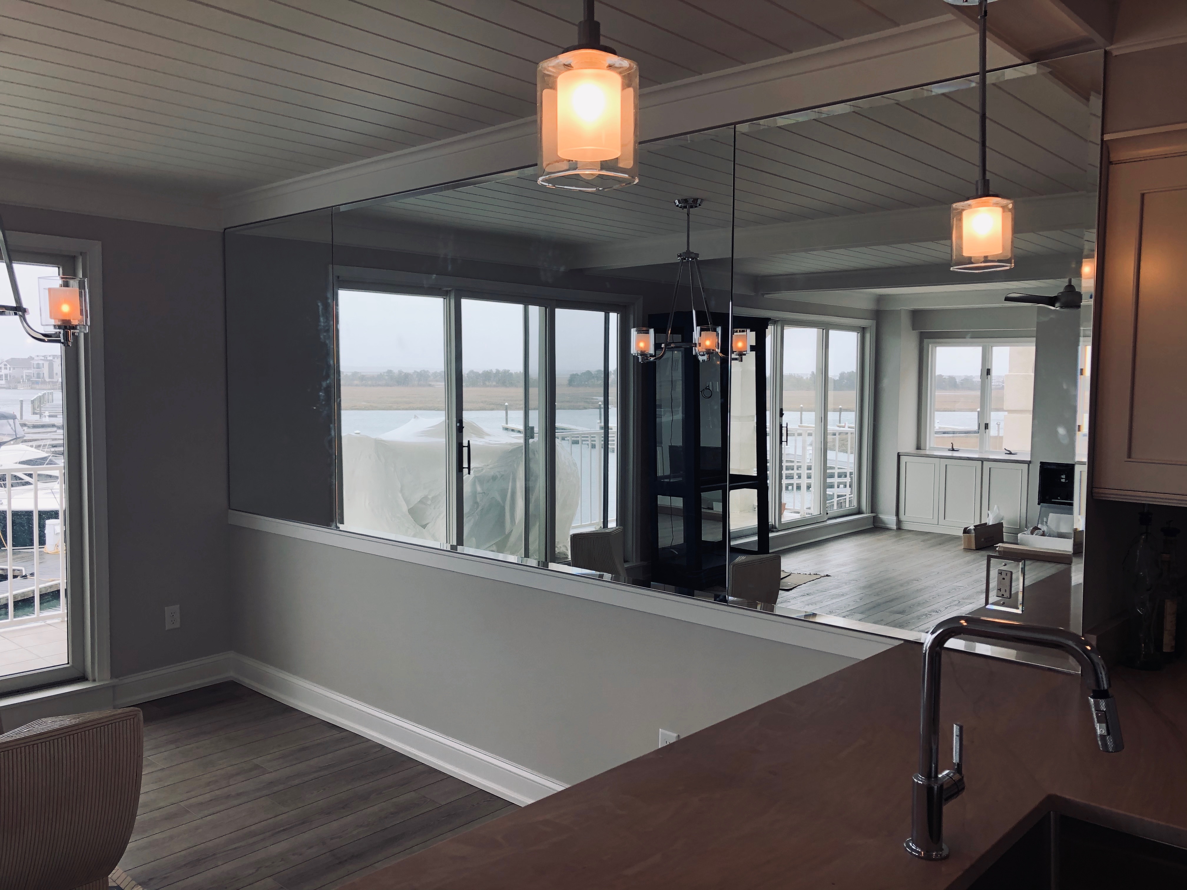 Modern glass partition with waterfront views