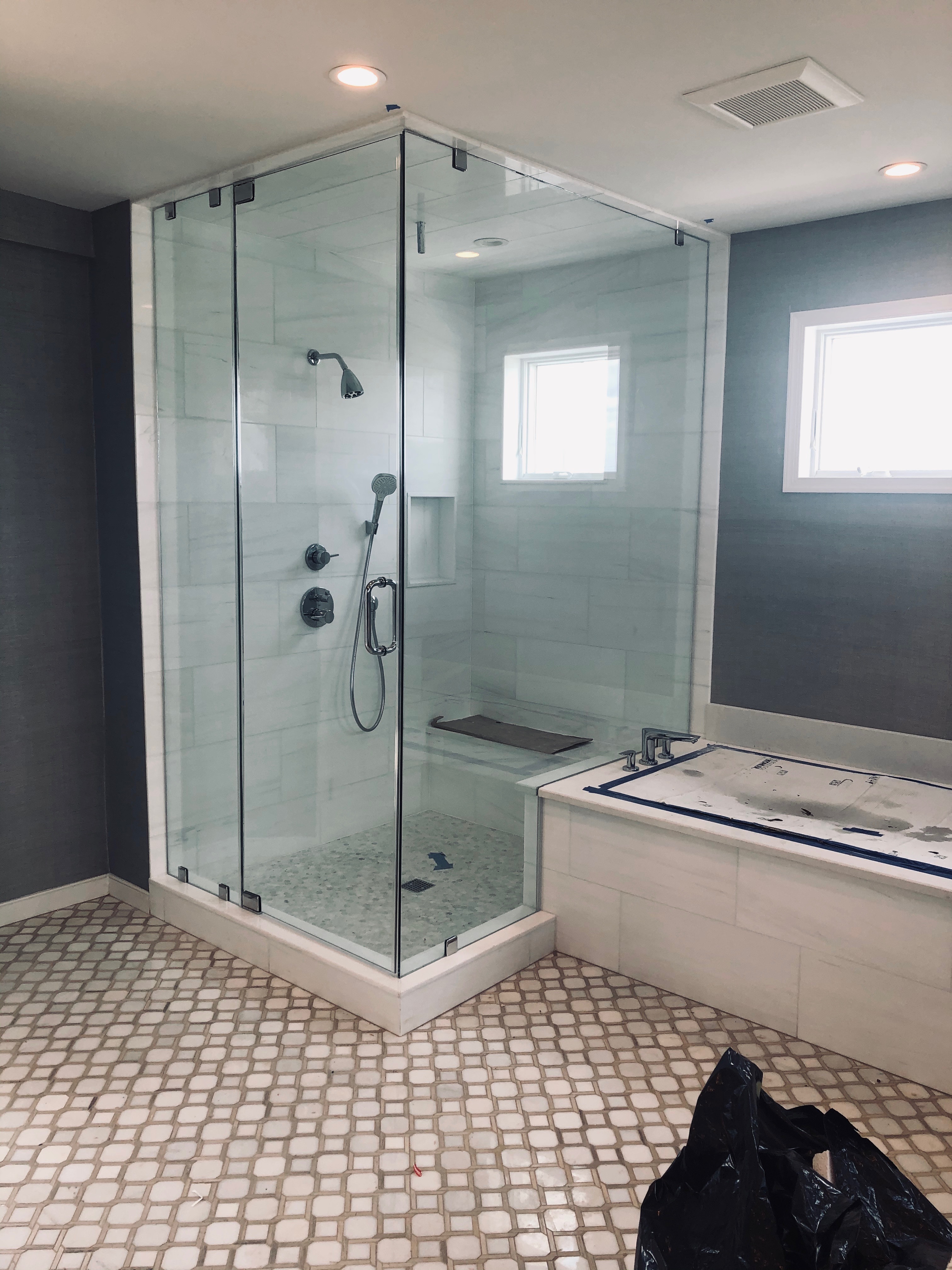 Custom enclosed glass shower enclosure